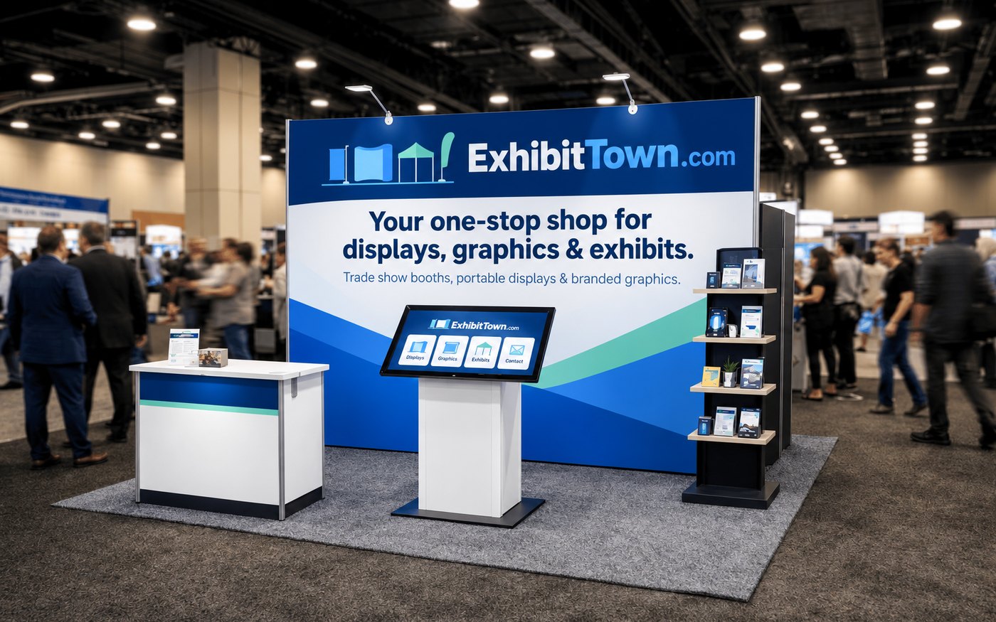 An ExhibitTown.com trade show booth with a branded backwall, counter, touchscreen kiosk and literature rack on a busy show floor